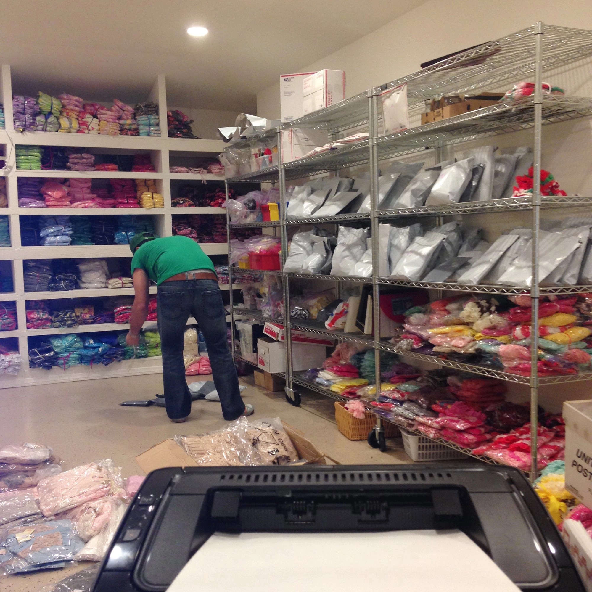 Garage with clothing racks and shelves to store Posh Peanut clothing