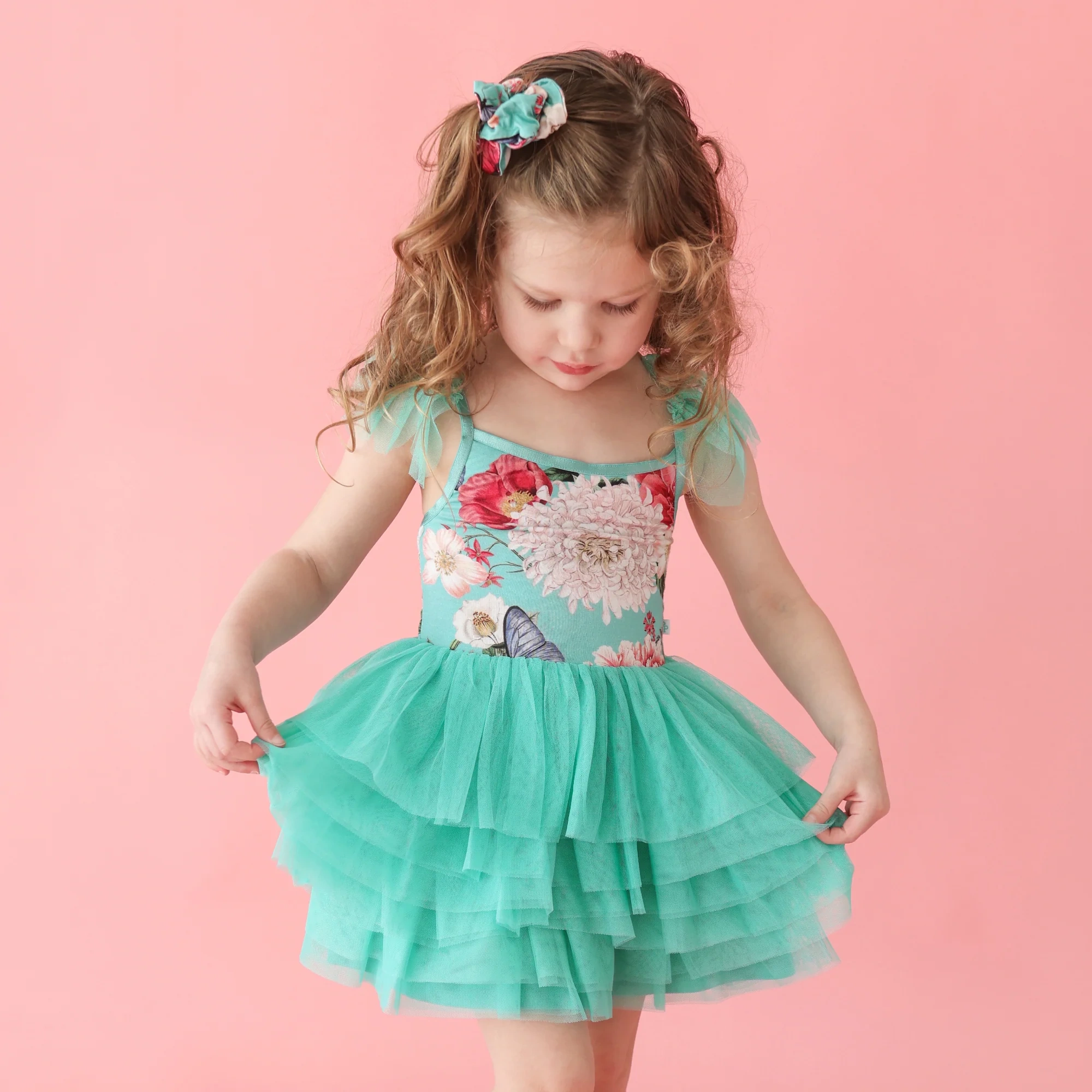 Girl wearing tulle floral teal dress