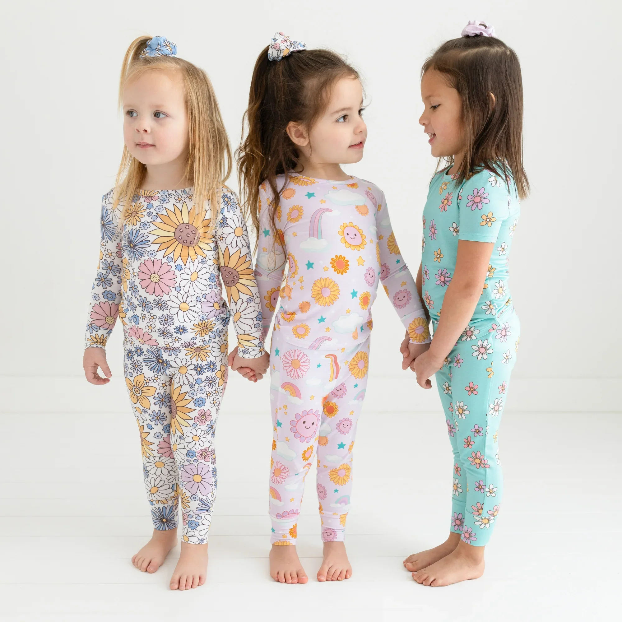 Three girls wearing floral pajamas